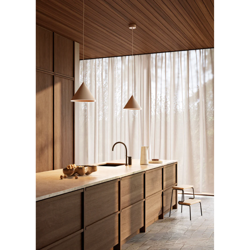 The Annular Pendant from Woud above a kitchen island in an open space kitchen.