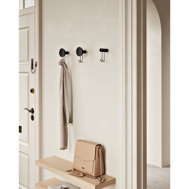 The Around Wall Hanger (Large) from Woud in an entryway.