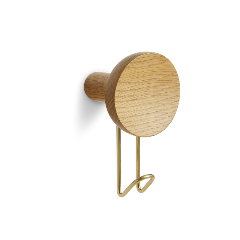 The Around Wall Hanger (Large) from Woud in oak with a satin brass hook.