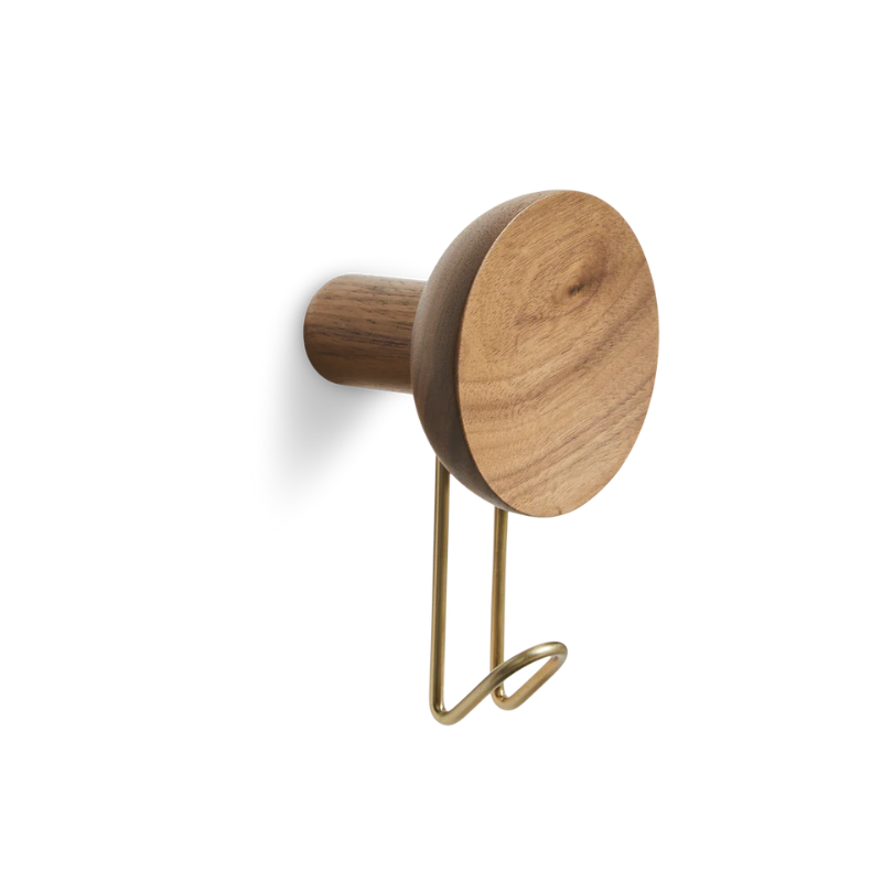 The Around Wall Hanger (Large) from Woud in walnut with a satin brass hook.