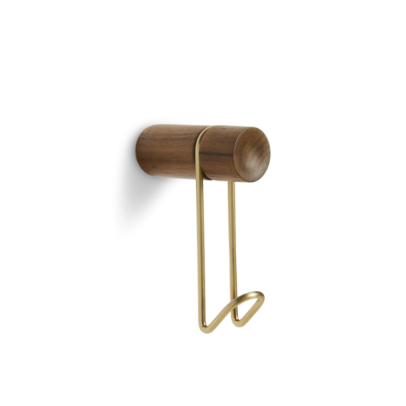 The Around Wall Hanger (Small) from Woud in walnut with the satin brass hook.