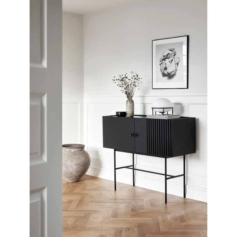 The small Array Sideboard from Woud in black within a family space.