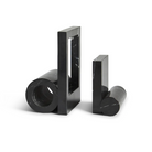 The Booknd from Woud, a solid marble bookend, in black.