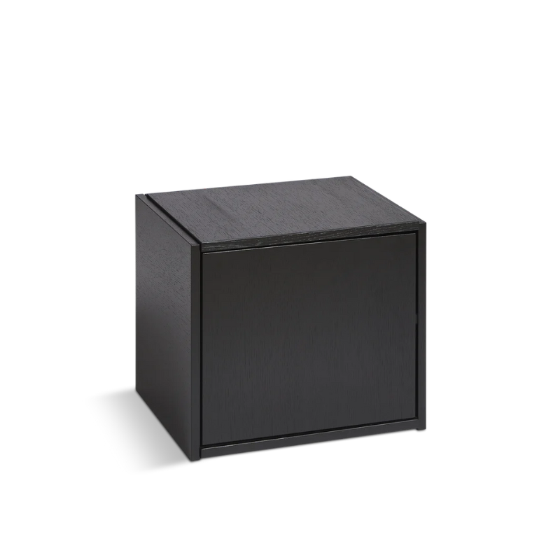 The Bricks Cube from Woud in black with the door option, closed.