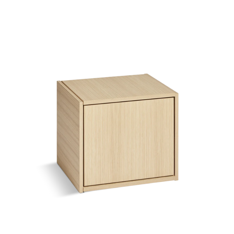 The Bricks Cube from Woud in white pigmented oak with the door option, closed.