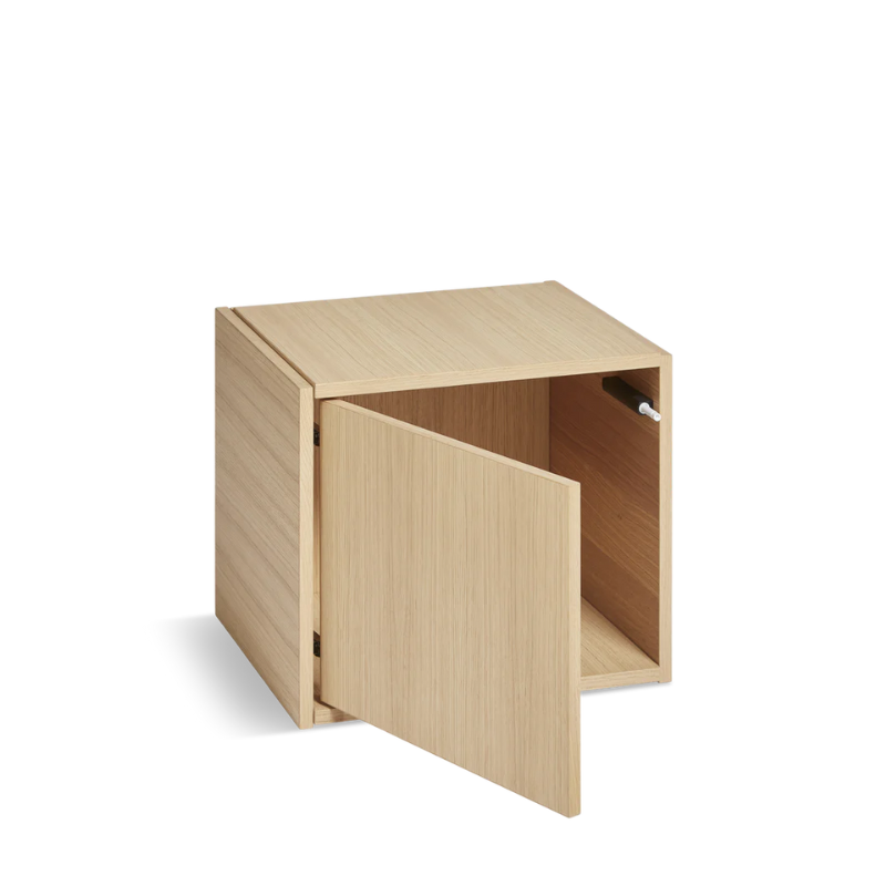 The Bricks Cube from Woud in white pigmented oak with the left door option.