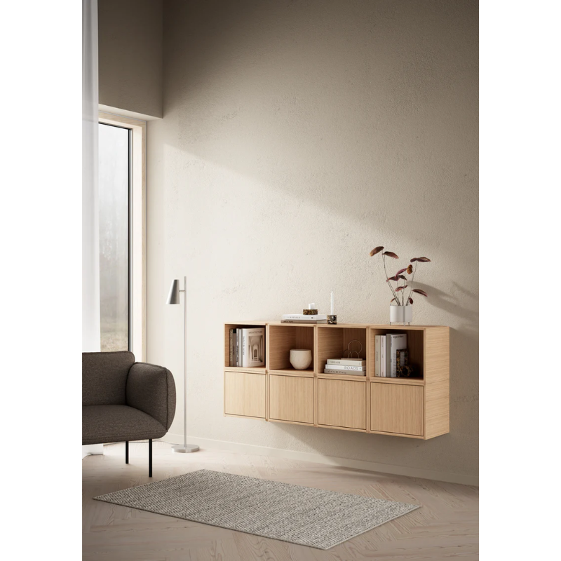 The Bricks Wall Mount from Woud being used to hold up oak Bricks Cubes within a living room space.