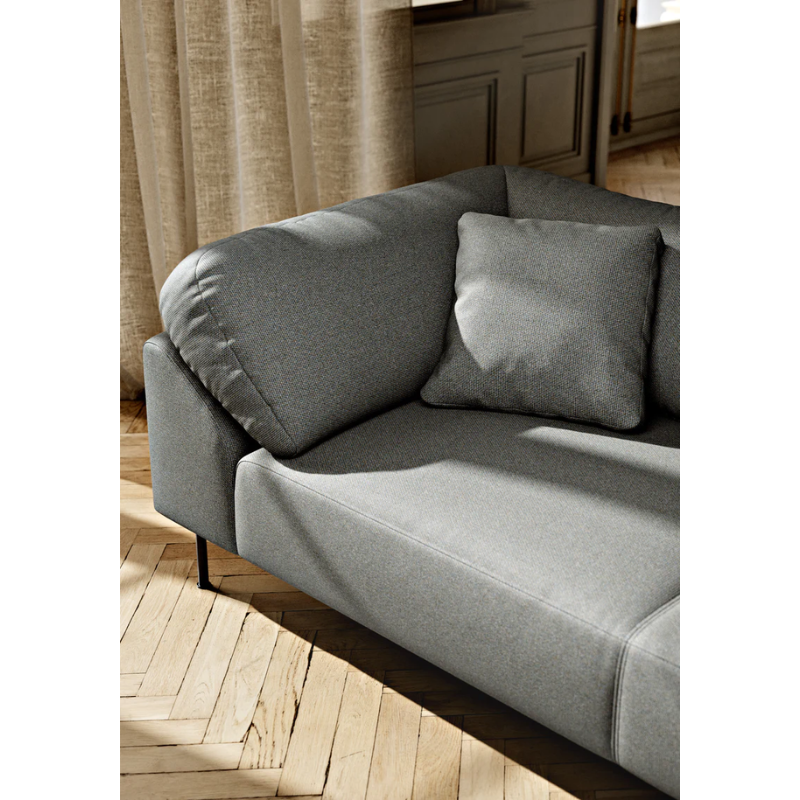 The Collar Open End Left (Arm Right) from Woud in a lifestyle photograph showing the upholstery.