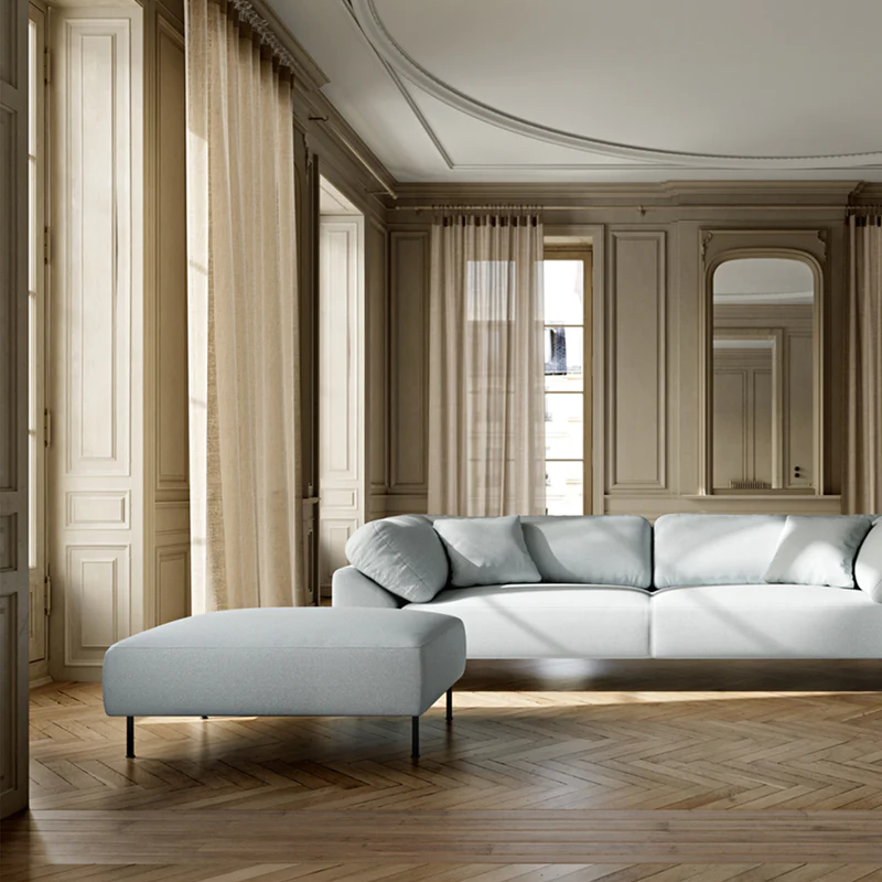 The Collar Ottoman from Woud in a lifestyle photograph within a lounge.