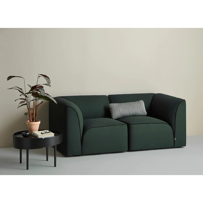 The Flora 2 Seater from Woud with custom fabric in a living room.