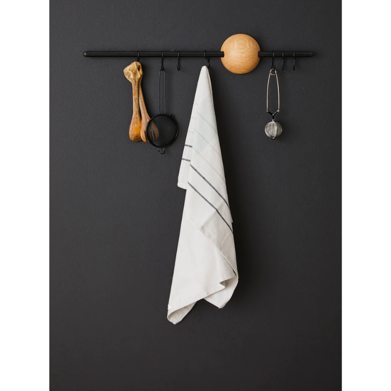 The Hoop Rack from Woud in black being used for a kitchen.