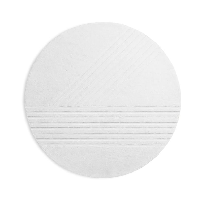 The Kyoto Rug by Woud which consists of 80% wool and 20% cotton. This is the off white color in the 200cm circle size.