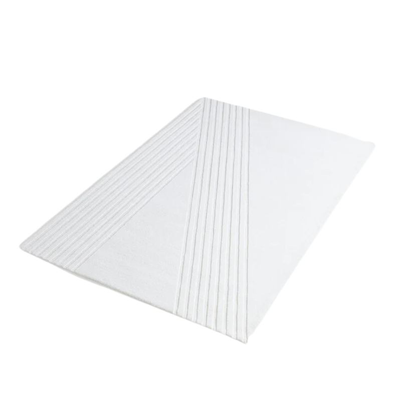 The Kyoto Rug by Woud which consists of 80% wool and 20% cotton. This is the off white color in 200 x 300 (cm) size from a side angle.