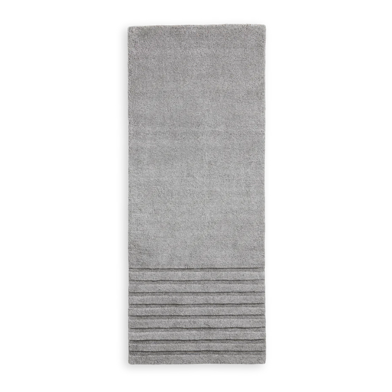 The Kyoto Rug by Woud which consists of 80% wool and 20% cotton. This is the grey color in 200 x 80 (cm) size.