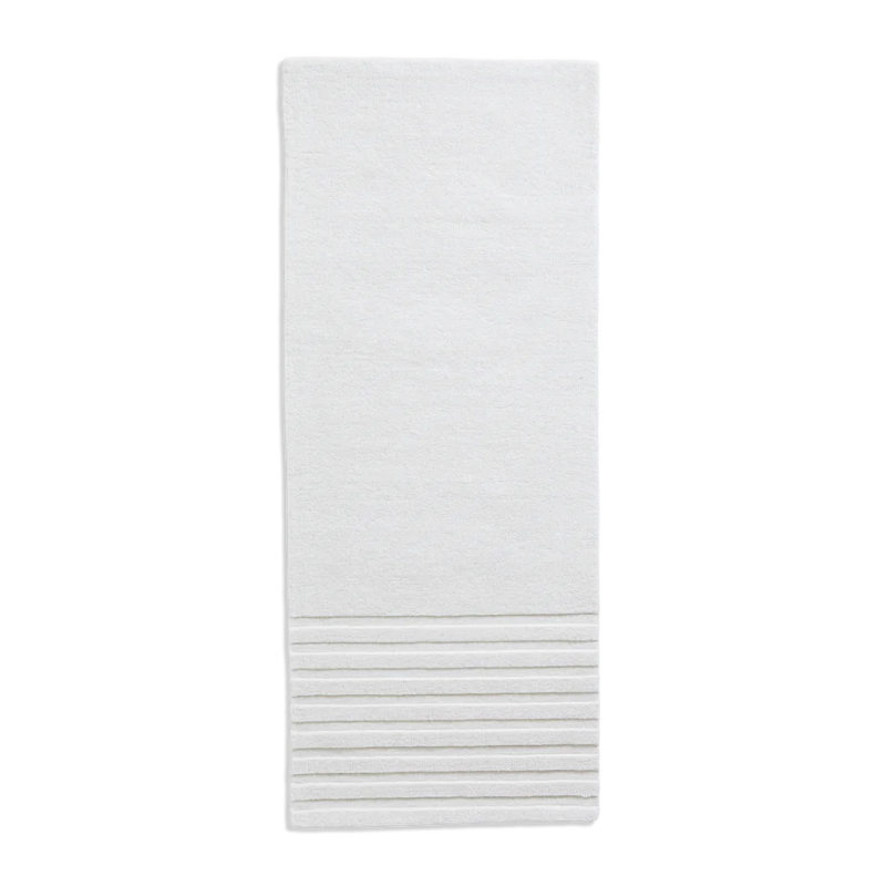 The Kyoto Rug by Woud which consists of 80% wool and 20% cotton. This is the off white color in 200 x 80 (cm) size.