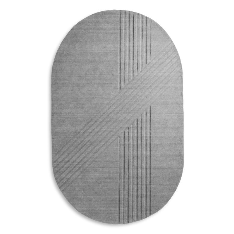 The Kyoto Rug by Woud which consists of 80% wool and 20% cotton. This is the grey color in the 210 by 340 (cm) oval size.