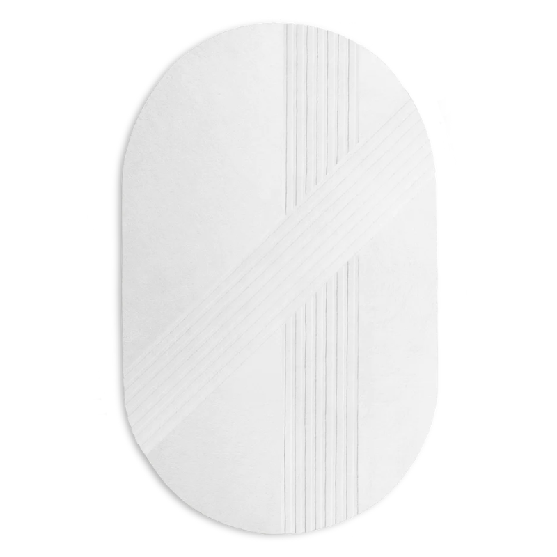 The Kyoto Rug by Woud which consists of 80% wool and 20% cotton. This is the off white color in the 210 by 340 (cm) oval size.