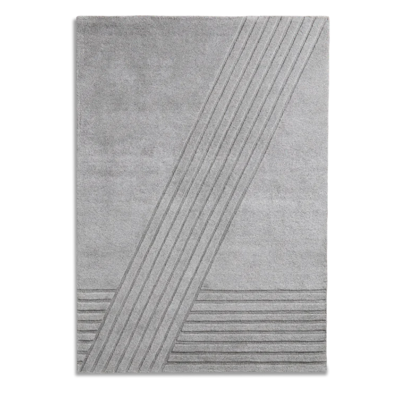 The Kyoto Rug by Woud which consists of 80% wool and 20% cotton. This is the grey color in 240 x 170 (cm) size.