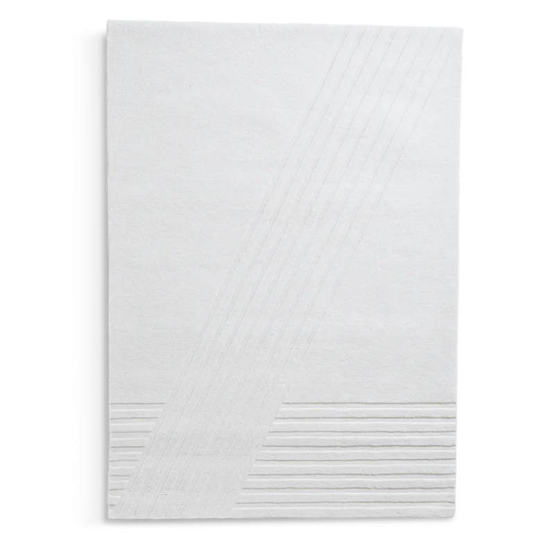 The Kyoto Rug by Woud which consists of 80% wool and 20% cotton. This is the off white color in 240 x 170 (cm) size.