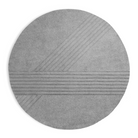 The Kyoto Rug by Woud which consists of 80% wool and 20% cotton. This is the grey color in the 250cm circle size.