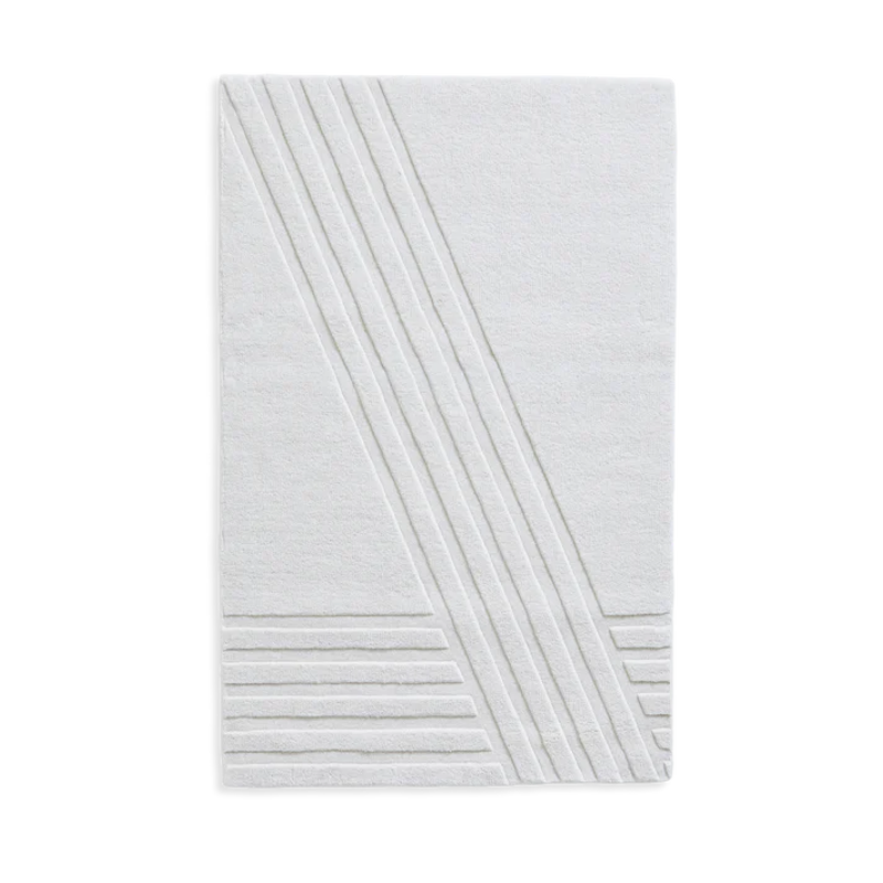 The Kyoto Rug by Woud which consists of 80% wool and 20% cotton. This is the off white color in 90 x 140 (cm) size.
