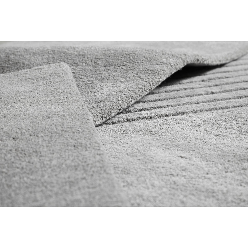 A close up on the fabric used for the grey Kyoto Rug from Woud showing the fine detail of the piece.