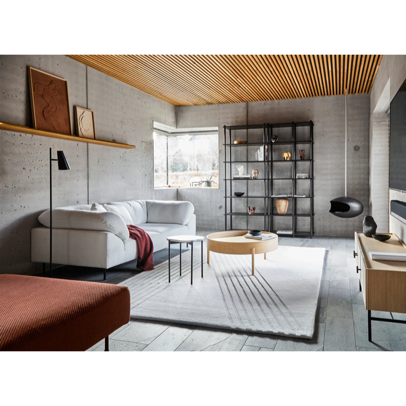 The Kyoto Rug from Woud in a modern lounge space designed for relaxing and entertainment.