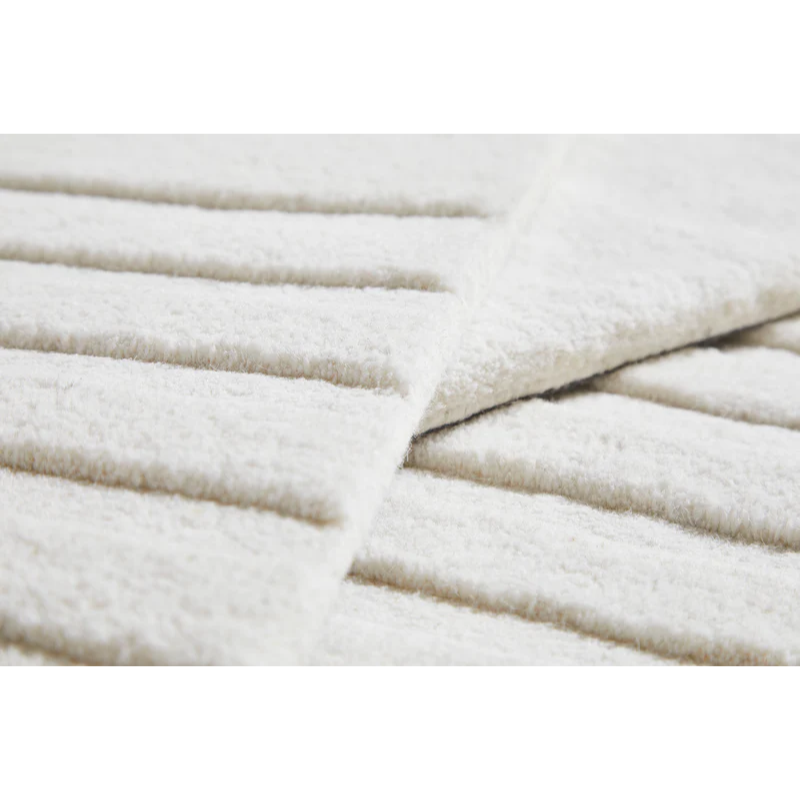 A close up on the fabric used for the off white Kyoto Rug from Woud.