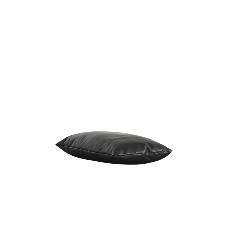The Level Daybed Pillow from Woud made from aniline leather in black.