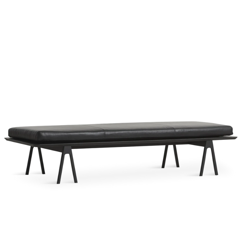 The Level Daybed from Woud with black leather cushion and black frame.