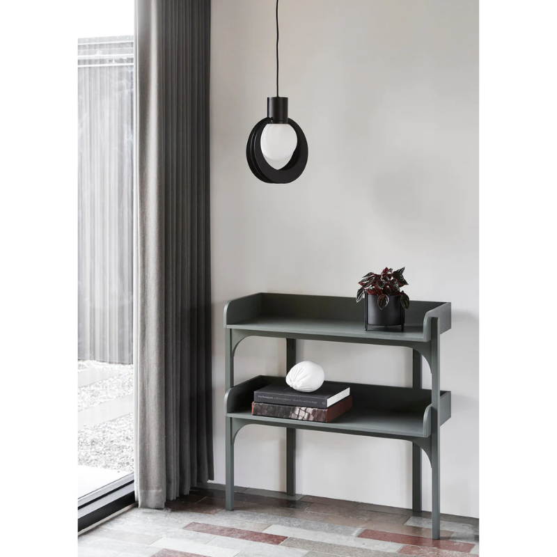 The Lunar Pendant from Woud within a family space.