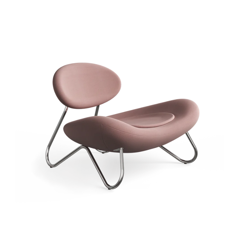 The Meadow Lounge Chair from Woud with dusty rose fabric and chrome legs.
