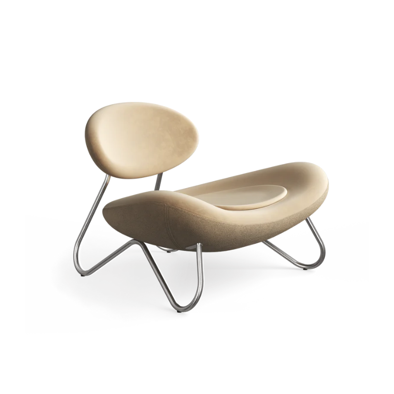 The Meadow Lounge Chair from Woud with gold leather and brushed steel legs.