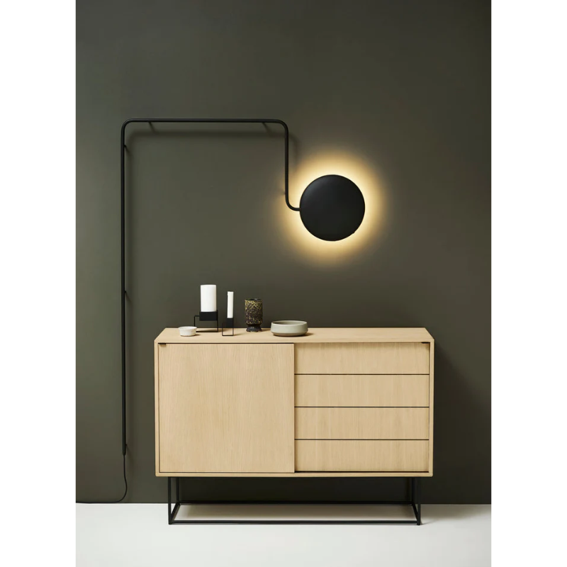 The Mercury Wall Lamp from Woud in a lounge.
