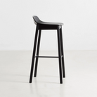 The Mono Bar Stool from Woud in a side angle lifestyle photograph.