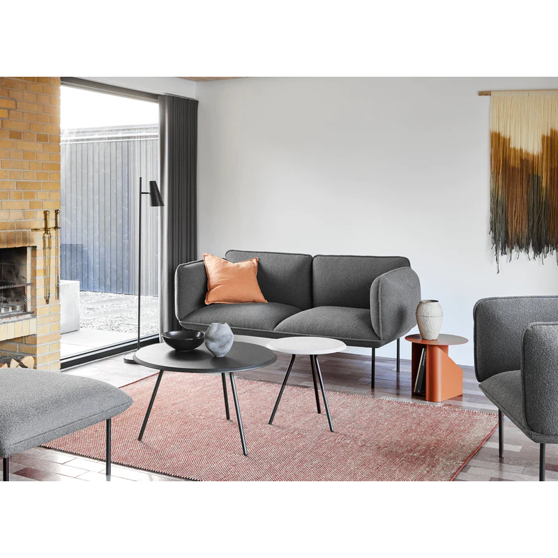 The Nakki 2 Seater from Woud with a custom fabric in a living room.