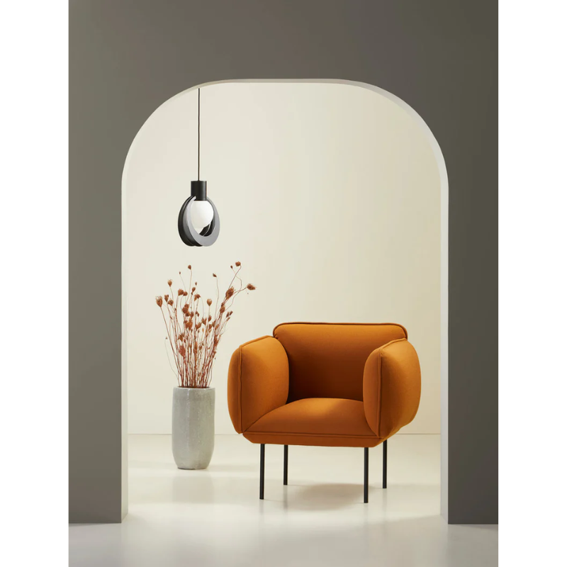 The Nakki Armchair from Woud with a custom fabric in a lounge.