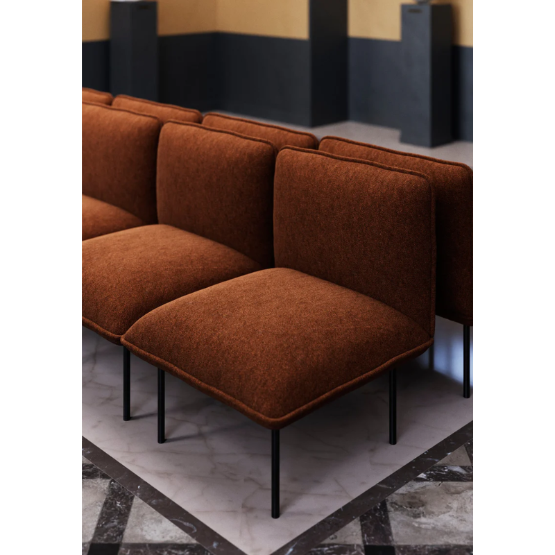 The Nakki Lobby Ottoman from Woud with a custom fabric in a business.