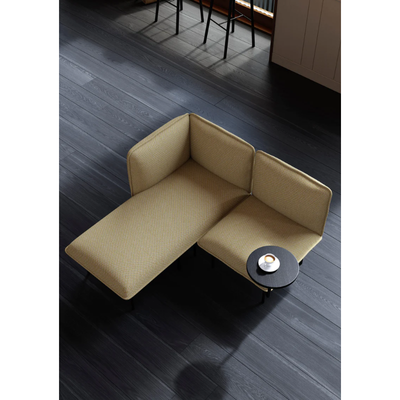 The Nakki Lobby Chaise Long Right from Woud with a custom fabric in a cafe.