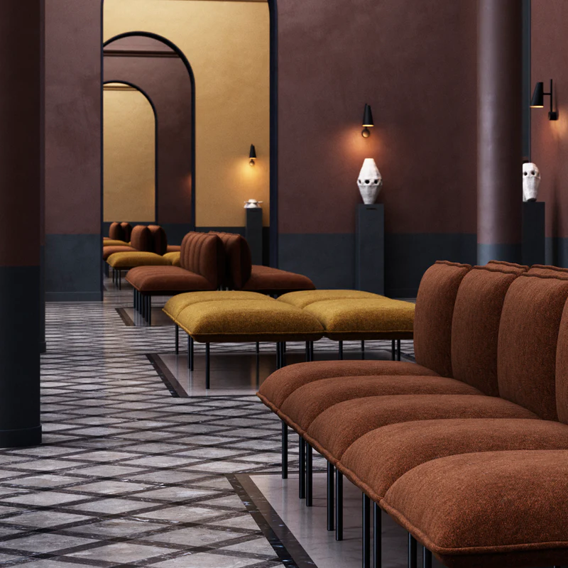 The Nakki Lobby Ottoman from Woud with a custom fabric in a hotel.