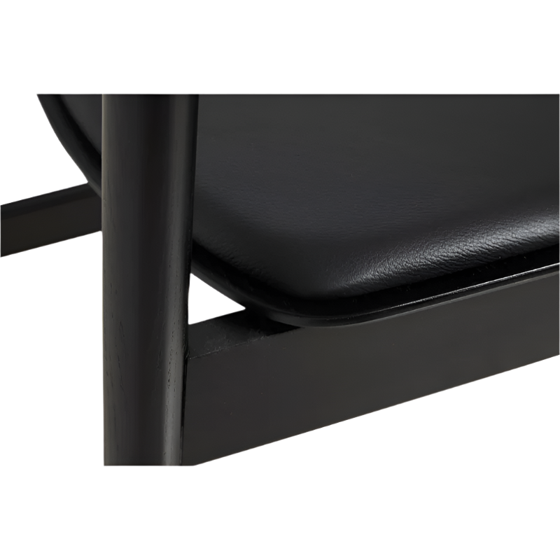 A close up on the Pause Dining Chair 2.0 from Woud in Black with Leather.