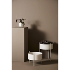 The small, medium and large Pidestall Planters in grey from Woud in a photograph.