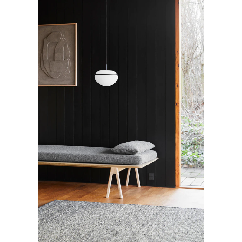 The Pump Pendant from Woud in a living room.