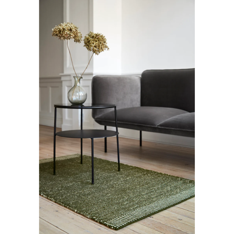 The Rombo Rug from Woud in a living room.