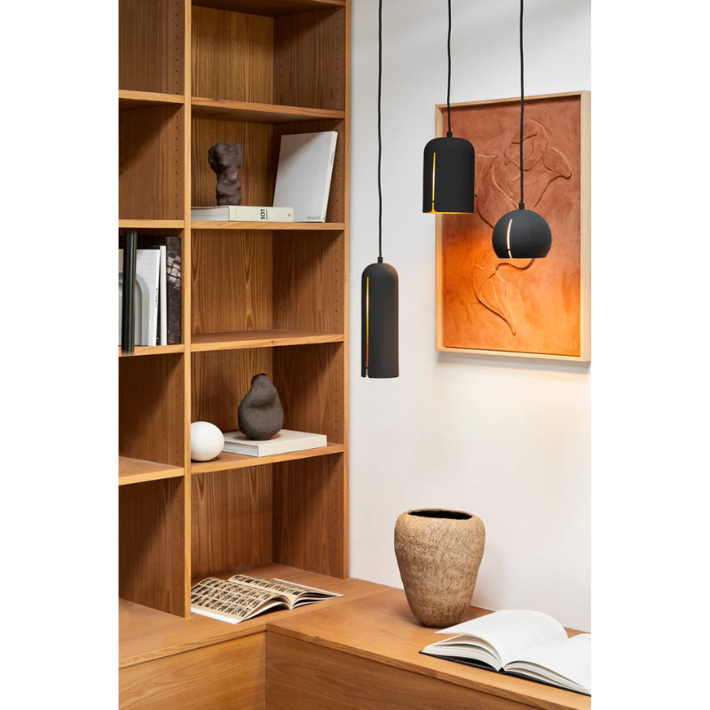 The Round Gap Pendant from Woud in a living room.