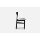 The Soma Dining Chair from Woud in Black with a side angle shot.
