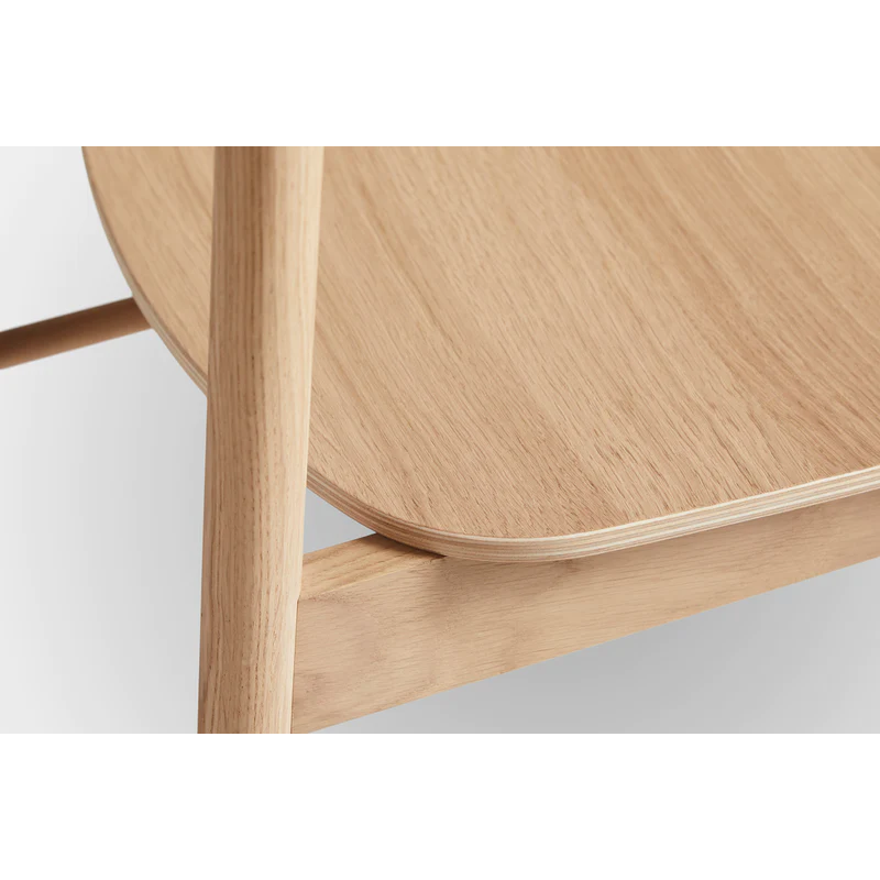 The Soma Dining Chair from Woud in White Pigmented Oak with a close up on the seat.