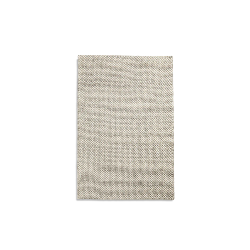 The Tact Rug from Woud in off white, 90 by 140 cm.