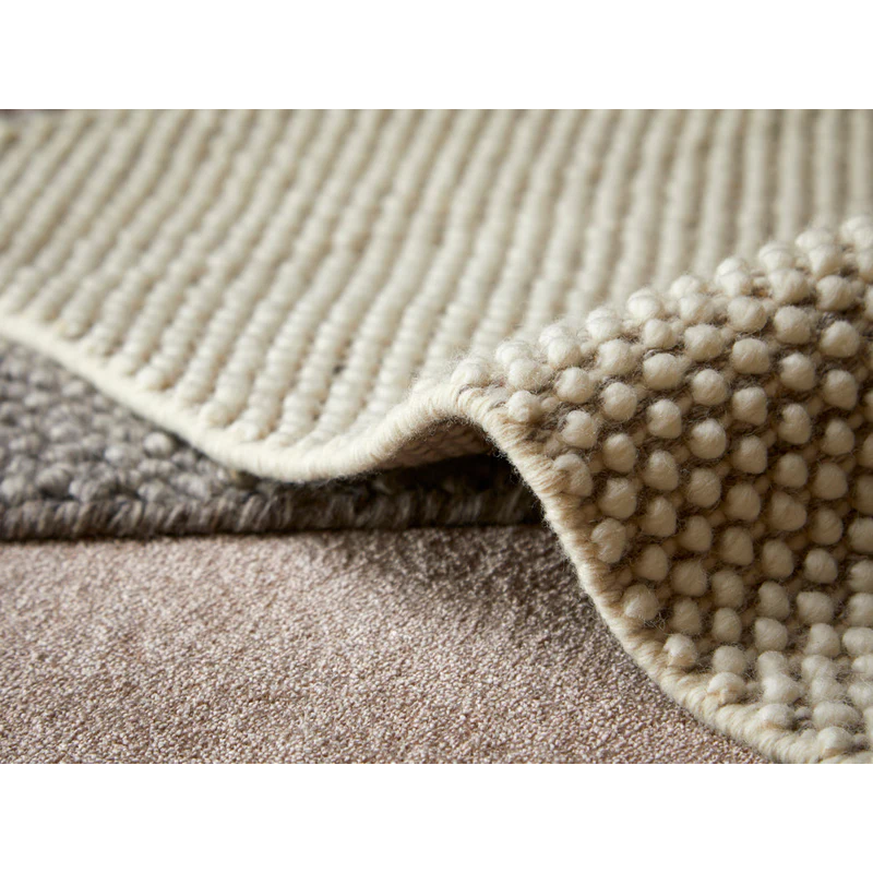 A couple of different color Tact Rugs from Woud.