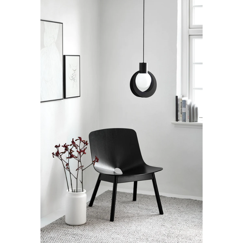 A Tact Rug from Woud in a seating space found in the corner.